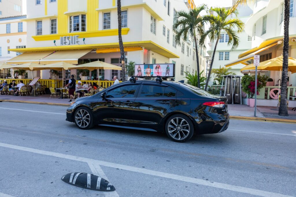 Car with sign on the roof