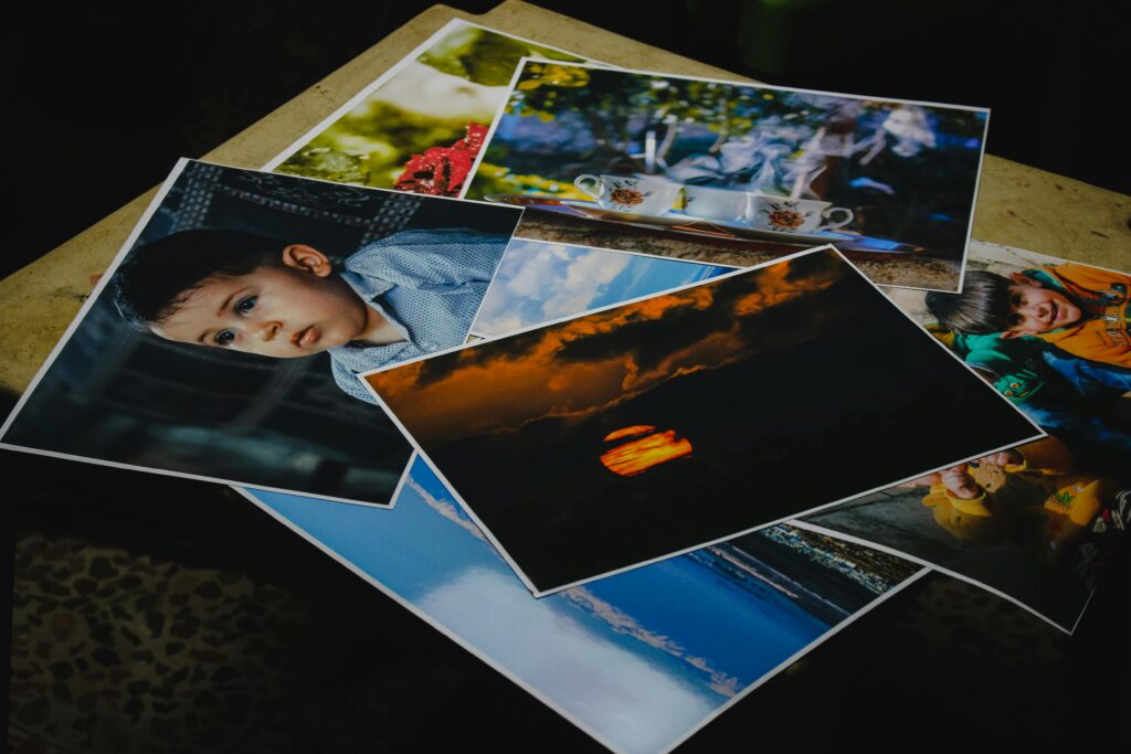 A pile of photographs lying on a table